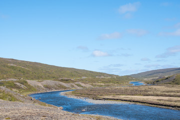 Eyvindara river in east Iceland on a sunny day