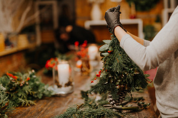 Obraz premium Christmas handmade decoration in young womans hands