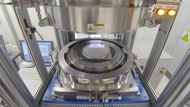 close up of a hot embossing polymer wafer machine in lab. Testing to emboss. Embossing device in al laboratory.