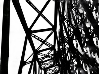 Abstract deconstruction architecture black and white manipulated photo of bridge metal construction. Geometry art photo.