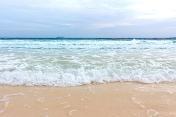 Blue ocean wave on sandy beach  summer day