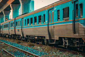 Diesel light rail train traveling to platform, traveling by train