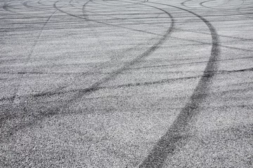 Deurstickers Skid marks tire marks on motor race track asphalt international circuit.shoot down view. © ABCDstock
