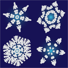 Kit of isolated  silhouettes of snowflakes on blue background.