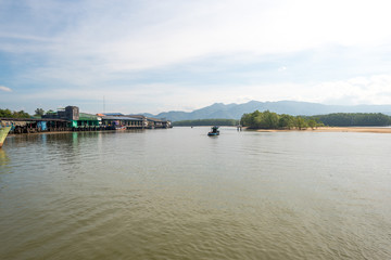 Obraz premium The Kraburi River estuary and the Tai Kak pier in the industrial estate of the Ranong fishing harbor in the south-west of Thailand
