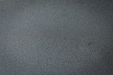 View of water droplets over car surface due to mist. Drizzle over shiny car surface.