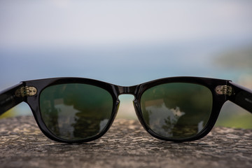 Fototapeta na wymiar sunglasses on blue background