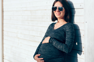 Trendy Young Pregnant Woman With Cool Sunglasses