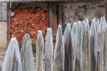 Snow on wooden fence