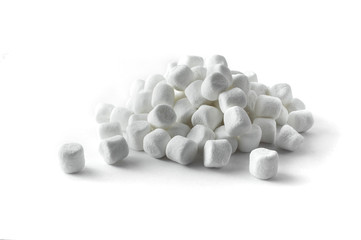 Small white marshmallows on white background