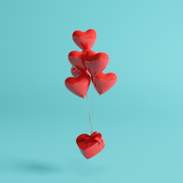 Heart balloons with gift box on pastel blue background. 3d rendering 