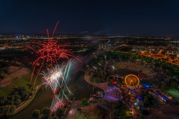 The colorful light of fireworks at Munich from a high angle.