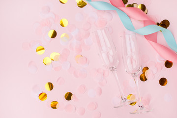 wineglasses on a pink background. Background for holiday, birthday, wedding, Valentine's day, Women's Day party. Top view, flat lay composition. Copy space for design.