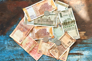 Fototapeta na wymiar Indian rupees. Indian money, banknotes, and coins in denominations of 1, 2, 10, 20, 200, 500. 