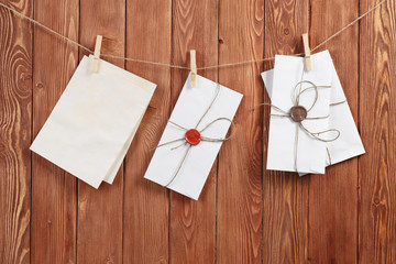 Envelopes pinned to rope . Mixed media