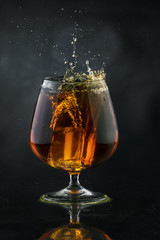 Spray in cognac glass
