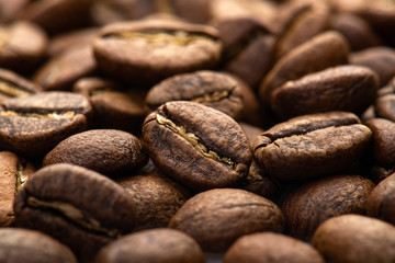 Coffee beans close-up background. Fresh roasted