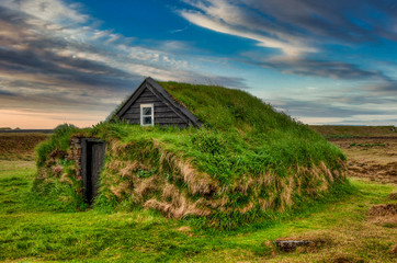 Fototapeta na wymiar Typical view of turf-top houses in Icelandic countryside.