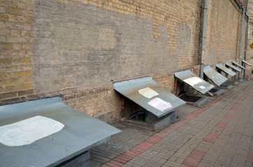 Poured windows of the lower floors of an old building. The traditional explanation of archaeologists is the accumulation of the cultural layer. Kiev , Ukraine