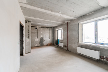 Russia, Omsk- August 05, 2019: interior room apartment. standard repair decoration in hostel. rough repair for self-finishing. interior decoration, bare walls of the room, stage of construction