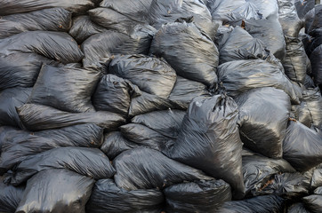 garbage bags, background. A lot of garbage bags piled up