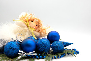 Fototapeta na wymiar Christmas composition on a blue sheet with a Christmas balls and star