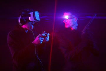 Man with virtual reality headset and gamepad and his virtual gaming avatar. Image with glitch effect.