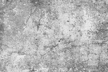 Fototapeta premium Texture of a concrete wall with cracks and scratches which can be used as a background