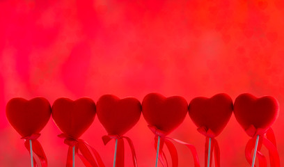 Red decorative heart in red bokeh background
