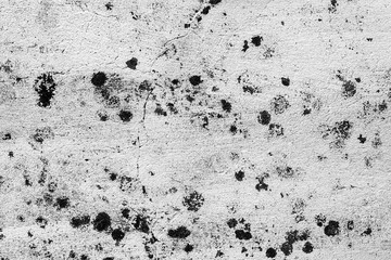 Texture of a concrete wall with cracks and scratches which can be used as a background