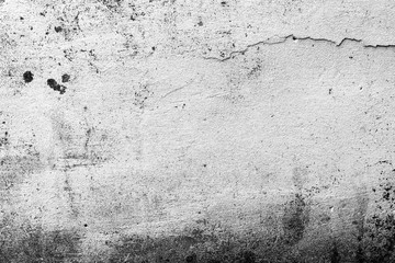 Texture of a concrete wall with cracks and scratches which can be used as a background