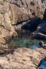 green water between rocks isle of skye fairy pools