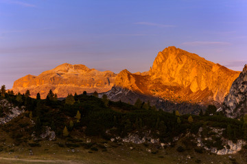  Sunrise over mountain range at Falzarego Pass in autunm season, Belluno Pronince, Dolomites, South Italy