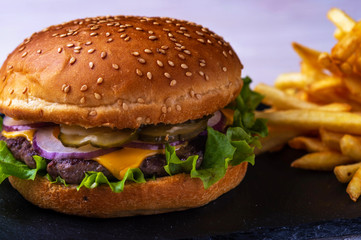 hamburger with bacon on black background