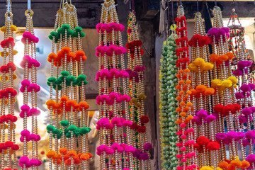 Colorful hanging decorations on display for sale in Chandi Chowk Old Delhi.