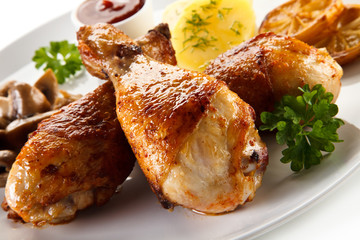 Barbecue chicken drumsticks with boiled potatoes and mushrooms