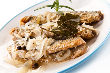Fried herrings in vinegar on white background