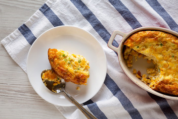 Homemade Cheddar Corn Pudding Casserole, view from above. Flat lay, top view, overhead.