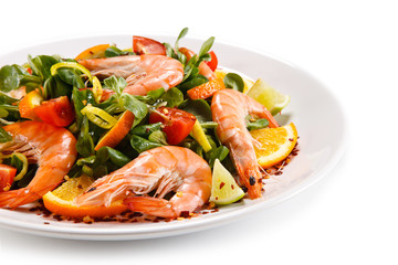 Prawns with vegetables on white background