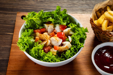 Fried cod and vegetables with french fries
