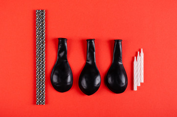 Air balloons composition on red background, party and celebration decoration.