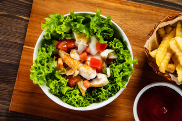 Fried cod and vegetables with french fries