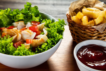 Fried cod and vegetables with french fries