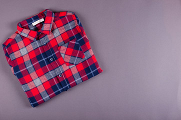 Textile, shirt composition on color background. Flat lay.