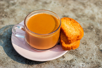 tea cup with toast biscuits in the morning.