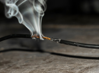 burning and smoking an electric cable cause of overload 