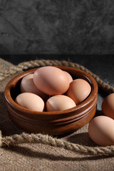 Group of of raw chicken eggs on rustic background, Organic eggs in loft style kitchen