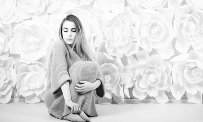 Young girl in a sweater in a room