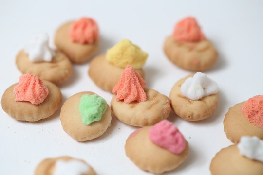 Belly button iced gem biscuits on white background