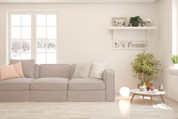 Stylish room in white color with sofa and winter landscape in window. Scandinavian interior design. 3D illustration